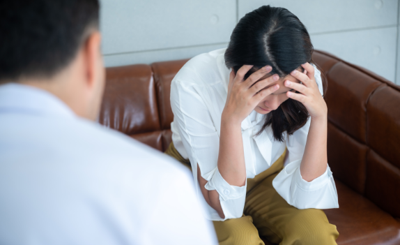 woman and a mental health professional during ptsd counseling